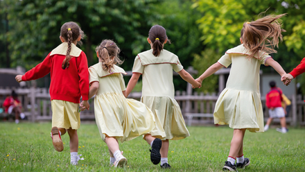 Girls running on grass.png